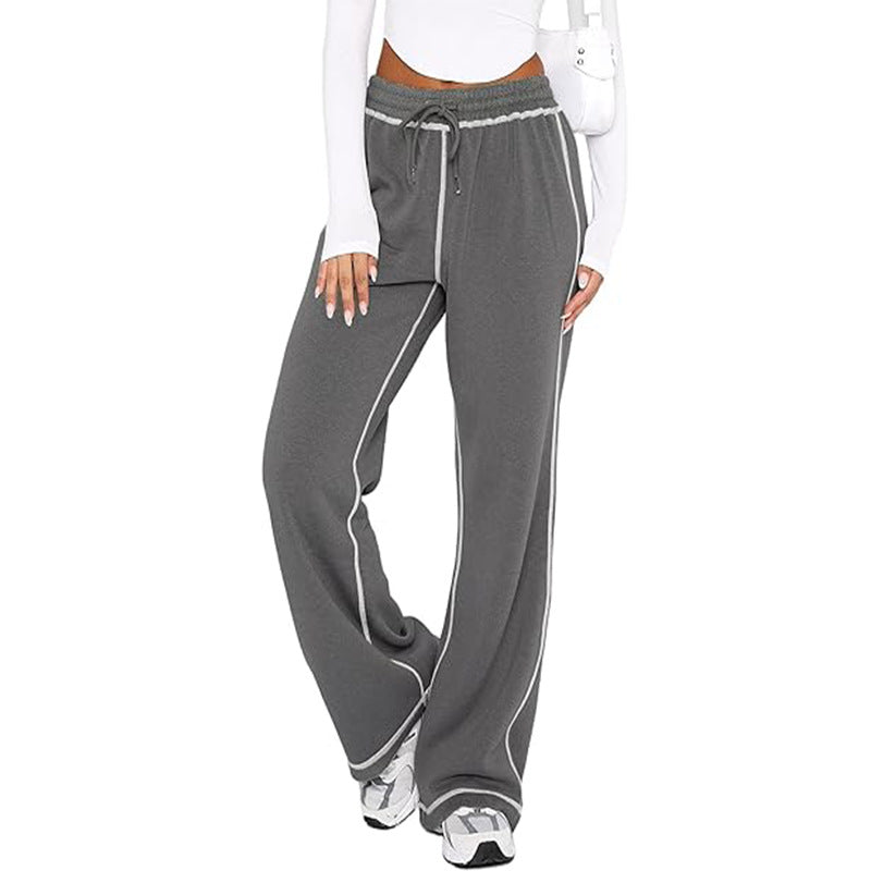 Gray wide-leg jogger sweatpants with drawstring and elastic waist, white side stripe