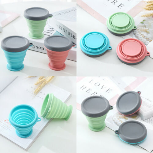 Collapsible silicone travel coffee cups in teal, coral, and mint with gray lids, nested