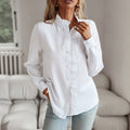 White striped ruffle button-up blouse with long sleeves and button front placket