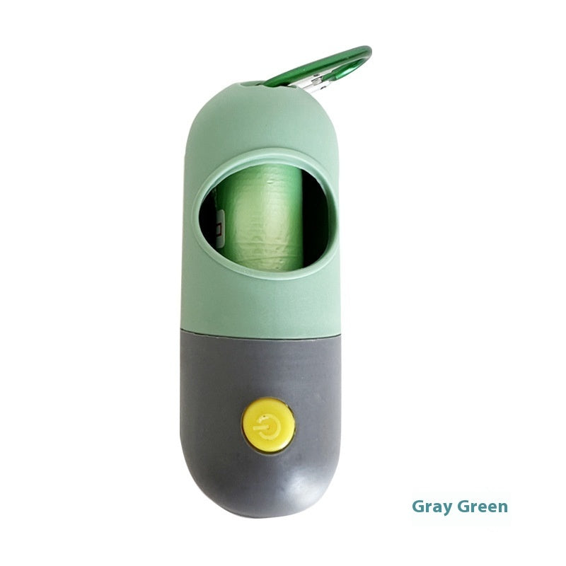 Gray-green LED pet waste bag dispenser with carabiner clip, green bag roll inside