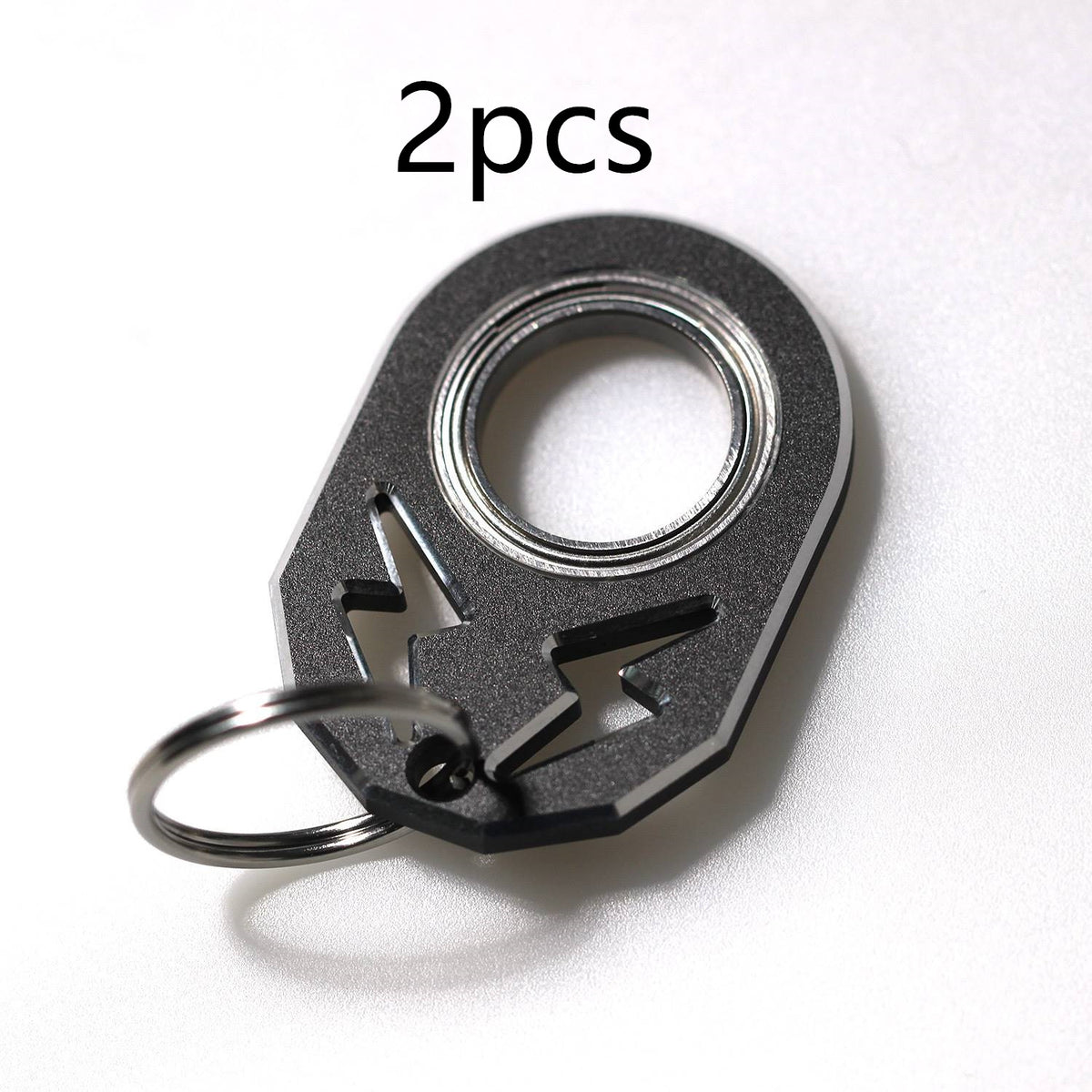 Black rotating decompression key chain with metal ring, 2-pack.