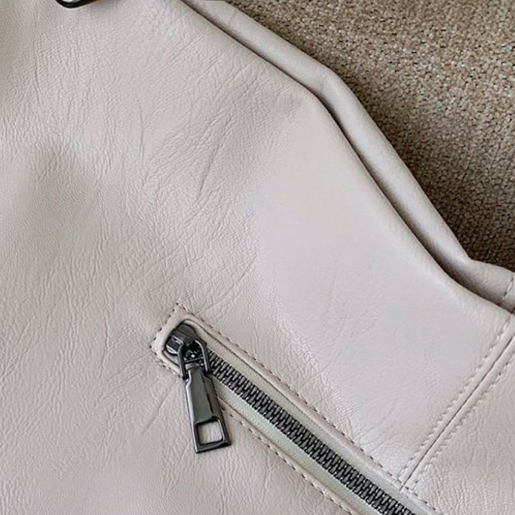 Ivory bag corner with small zip pocket and metal zipper pull