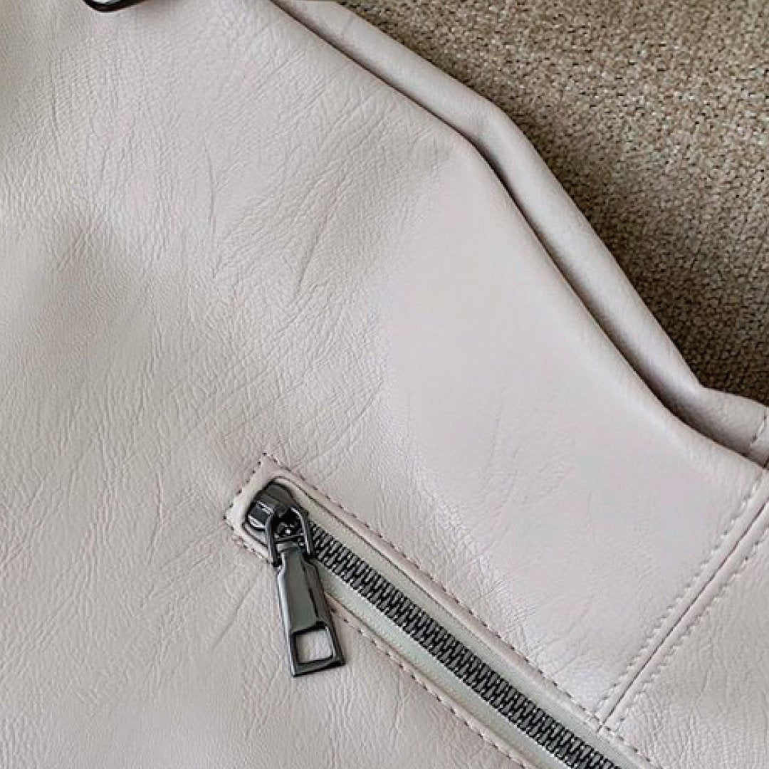 Ivory bag corner with small zip pocket and metal zipper pull