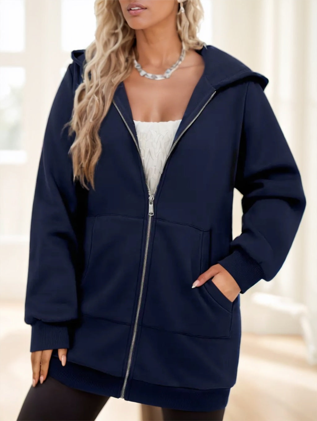 Women's navy long zip-up hoodie with hood and front pockets, full zipper closure