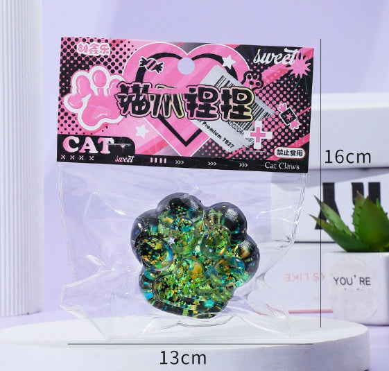 Green glitter cat paw stress toy in clear blister pack