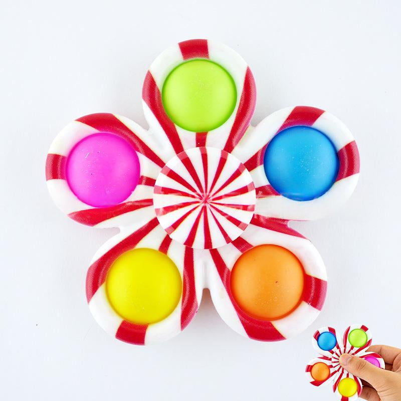 Red-and-white striped fidget spinner stress-relief toy with blue, pink, and green caps