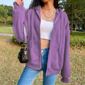 Women's hooded zip-front jacket in purple with front zipper, drawstring hood, and side pockets