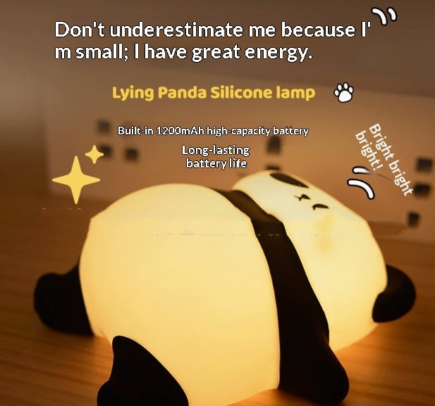 Lying panda silicone lamp with warm light glow, front close-up of lying panda