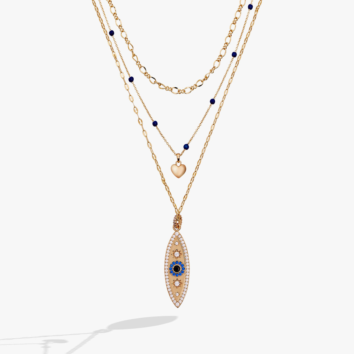 Gold evil eye pendant necklace with layered chains and blue bead accents