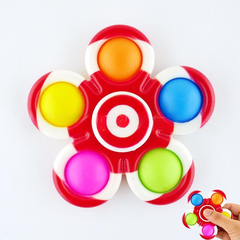 Red target-style fidget spinner with white and red frame and six colored button tips.