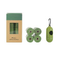 Green dog poop bag box with four rolls and a hanging waste bag holder