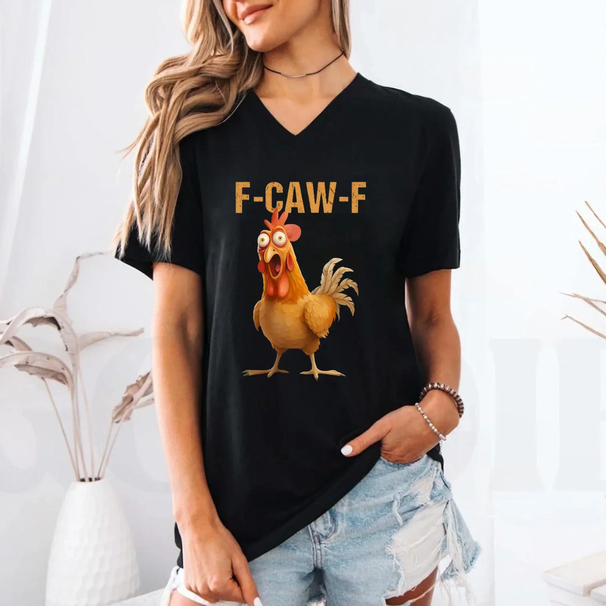 Black v-neck T-shirt on model with rooster graphic and "F-CAW-F" text