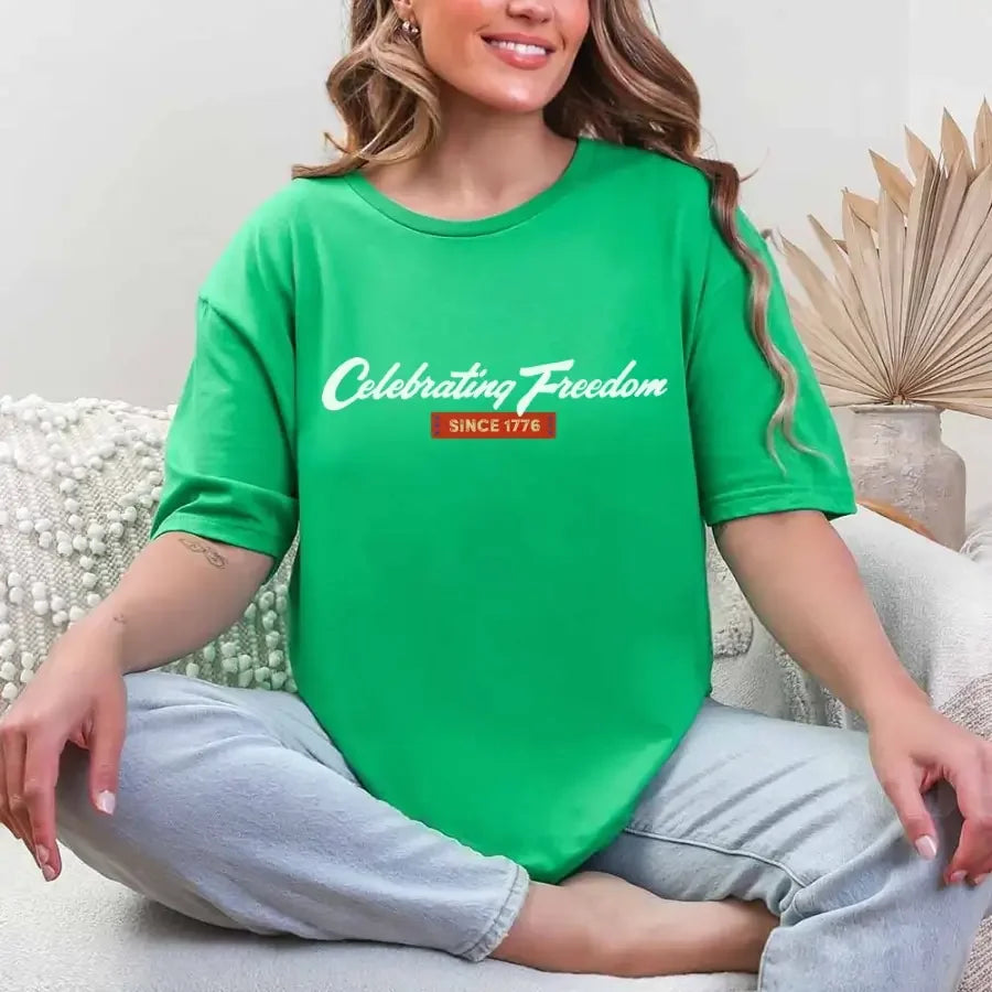 Green graphic t-shirt with “Celebrating Freedom” and “Since 1776” print