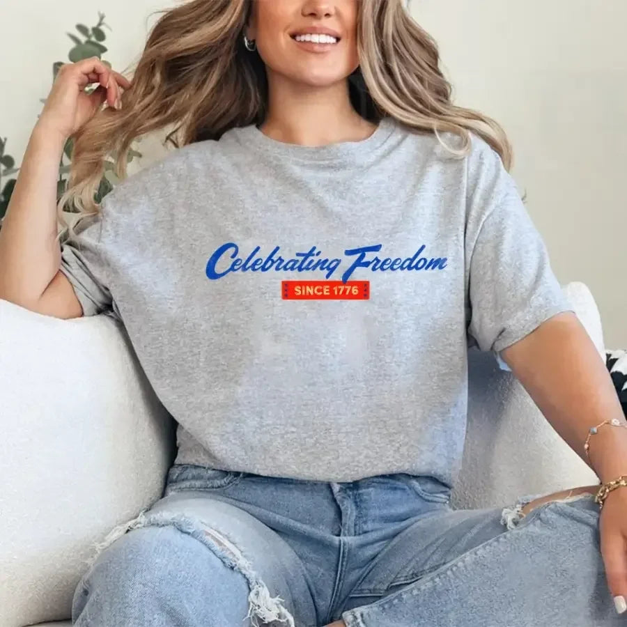 Heather gray graphic t-shirt with “Celebrating Freedom” and “Since 1776” print