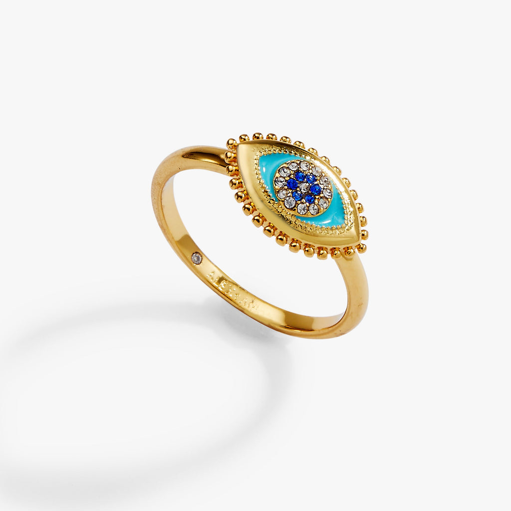 Gold evil eye healing stone ring with blue center stone and crystal bead halo