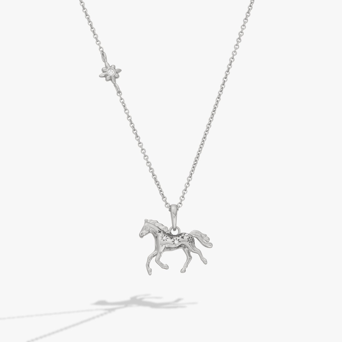 Silver horse pendant necklace with small flower charm and horse figure pendant