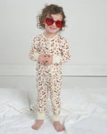 Toddler dog-print bamboo pajama romper with front zipper and long sleeves, cream base
