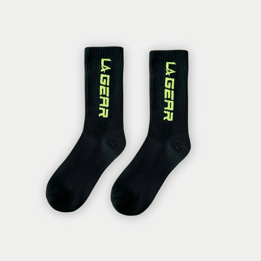 Black crew socks with neon yellow LA Gear logo lettering