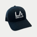 Black trucker hat with LA Gear logo on front