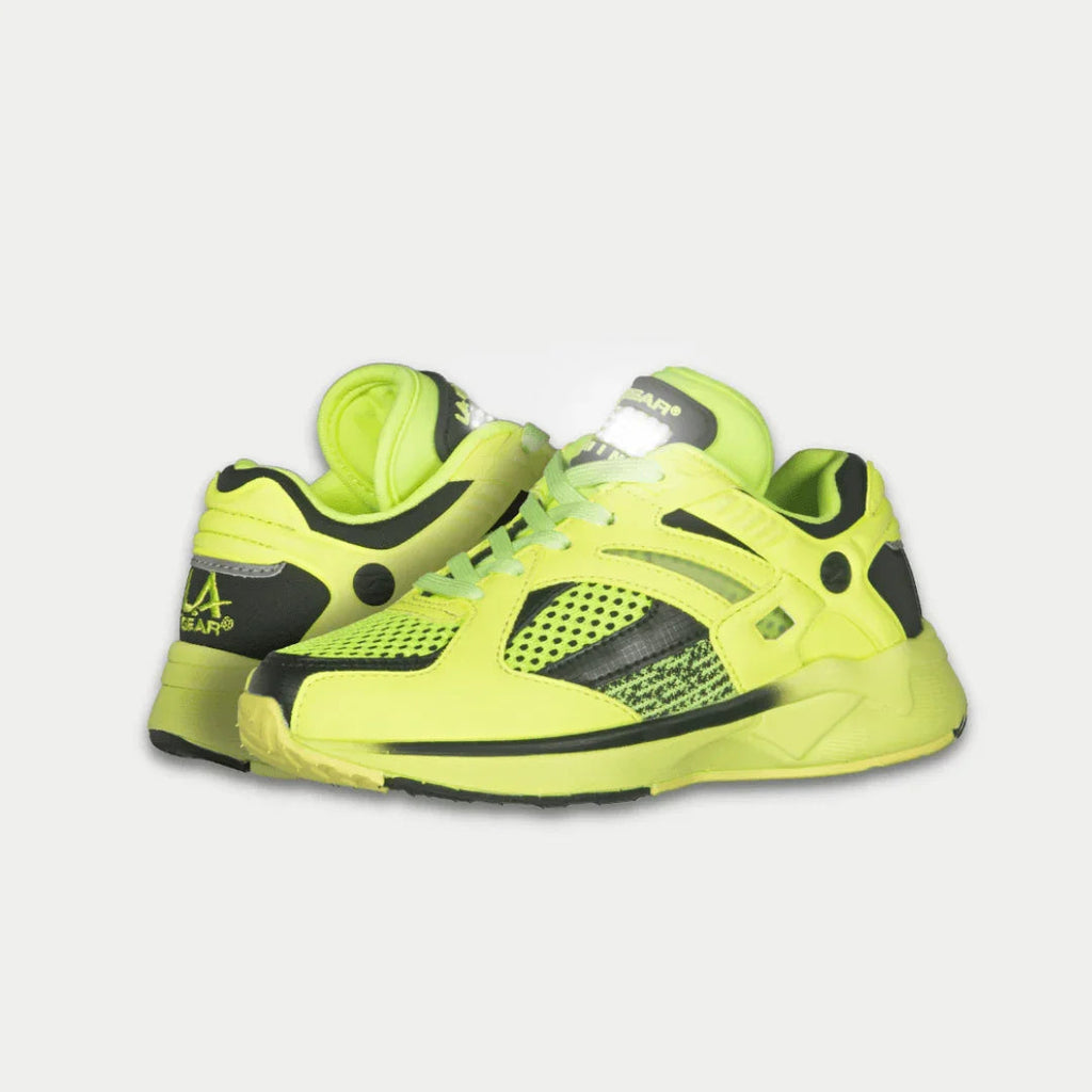 Kids neon yellow and black low-top light-up sneakers, front side angle with black accents