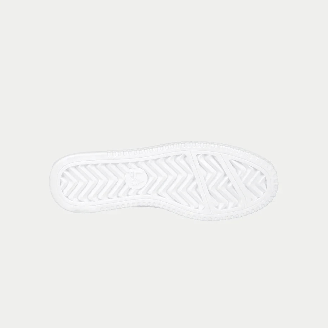 Kids white lowtop sneakers with textured rubber outsole tread