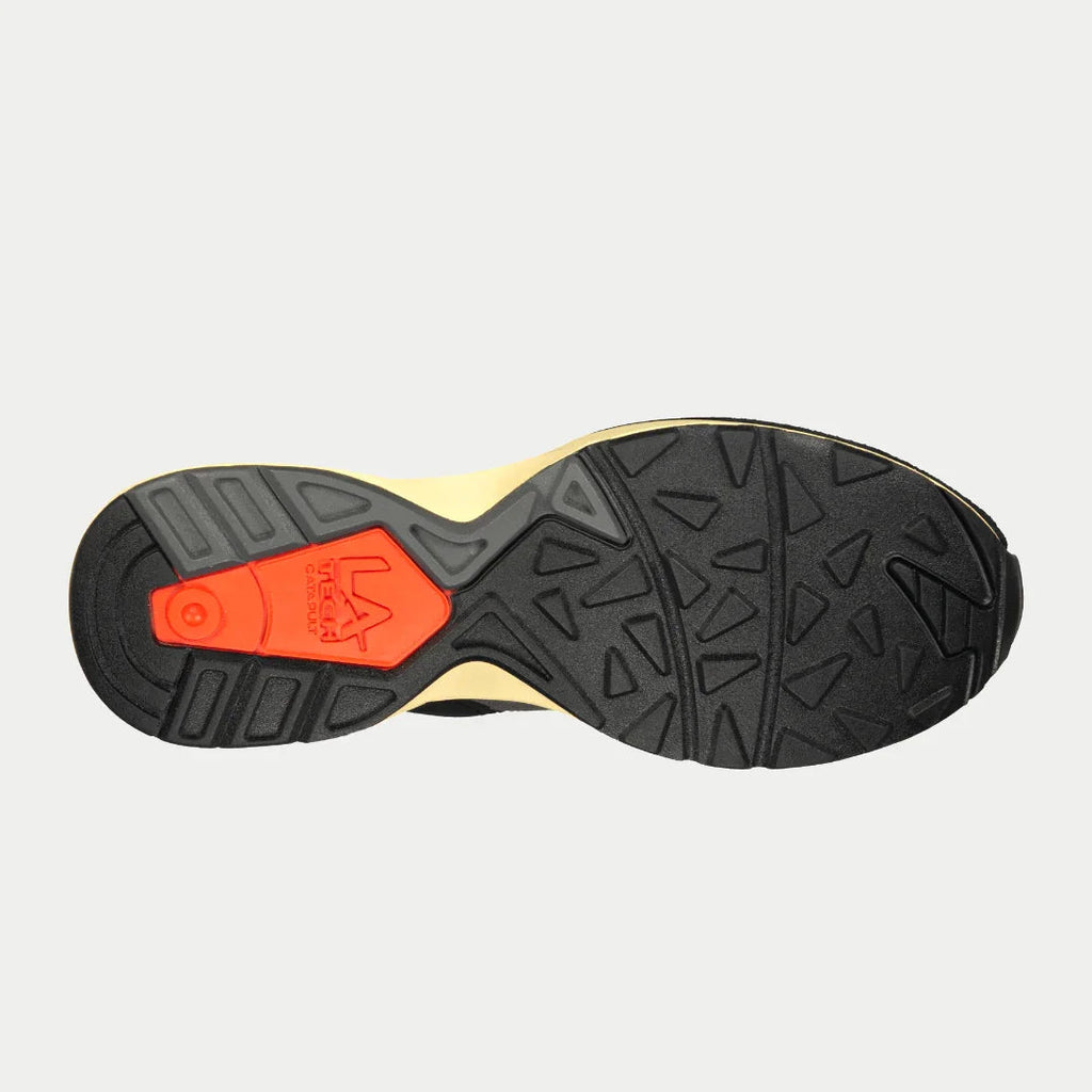 Outsole view of men's light-up lowtop sneakers with black tread and red traction insert