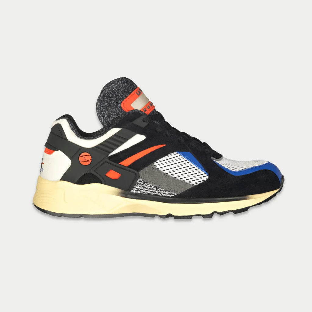 Men's light-up lowtop sneakers in black with orange accents, blue and white panels, cream sole