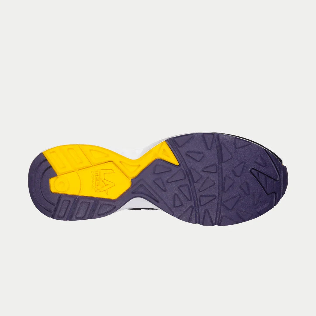 Outsole of men's light-up sneaker with purple tread and bright yellow traction insert