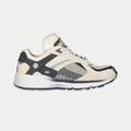 White and black lowtop lace-up sneaker with suede-look panels and chunky rubber sole