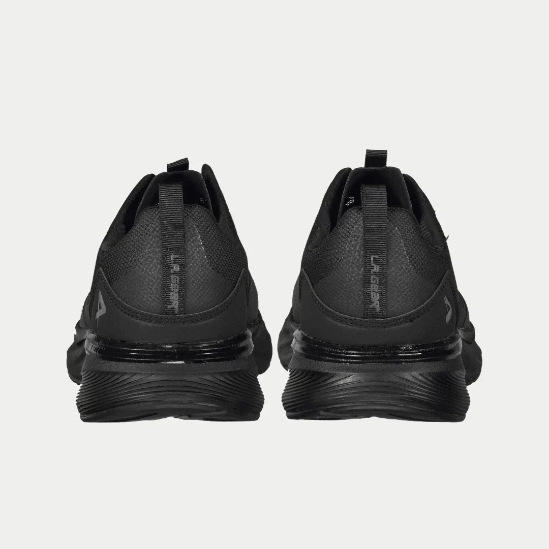 Black lowtop sneakers showing heel counter and ribbed, multi-layer sole