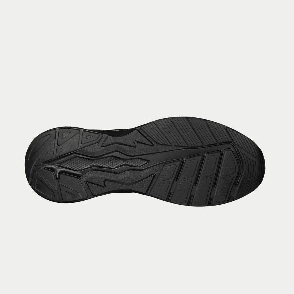 Black sneaker outsole with molded traction pattern and deep tread grooves