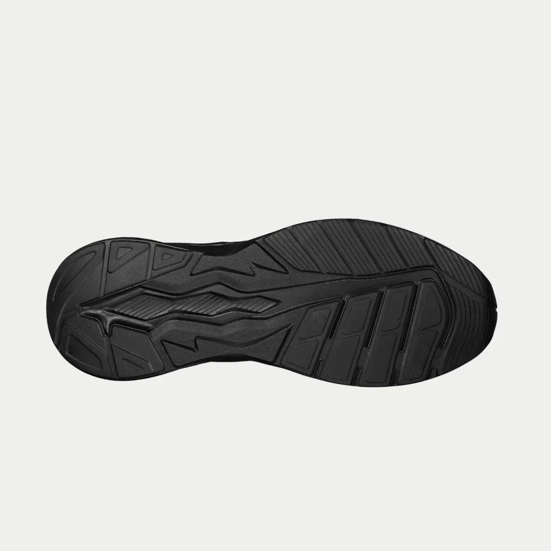 Black sneaker outsole with molded traction pattern and deep tread grooves