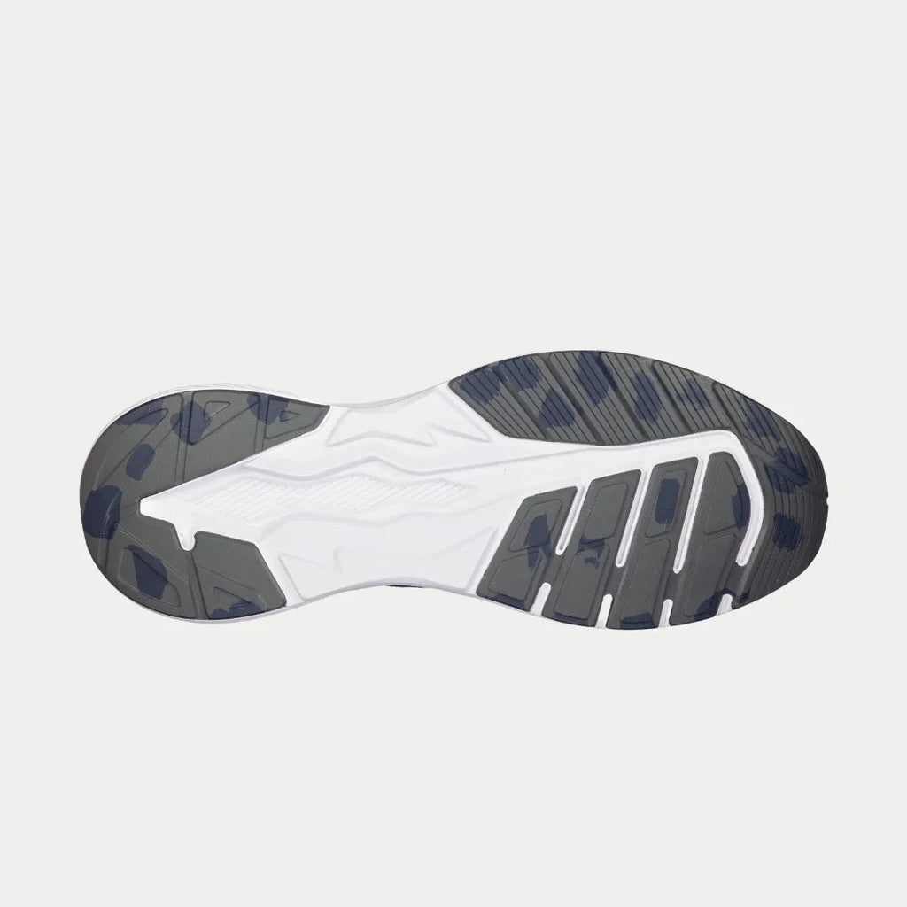 Outsole of navy blue lowtop sneakers with tread pattern