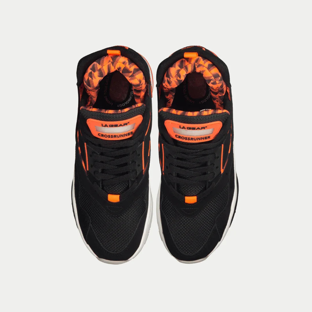 Men's black low-profile sneakers with neon orange interior lining and lace-up front