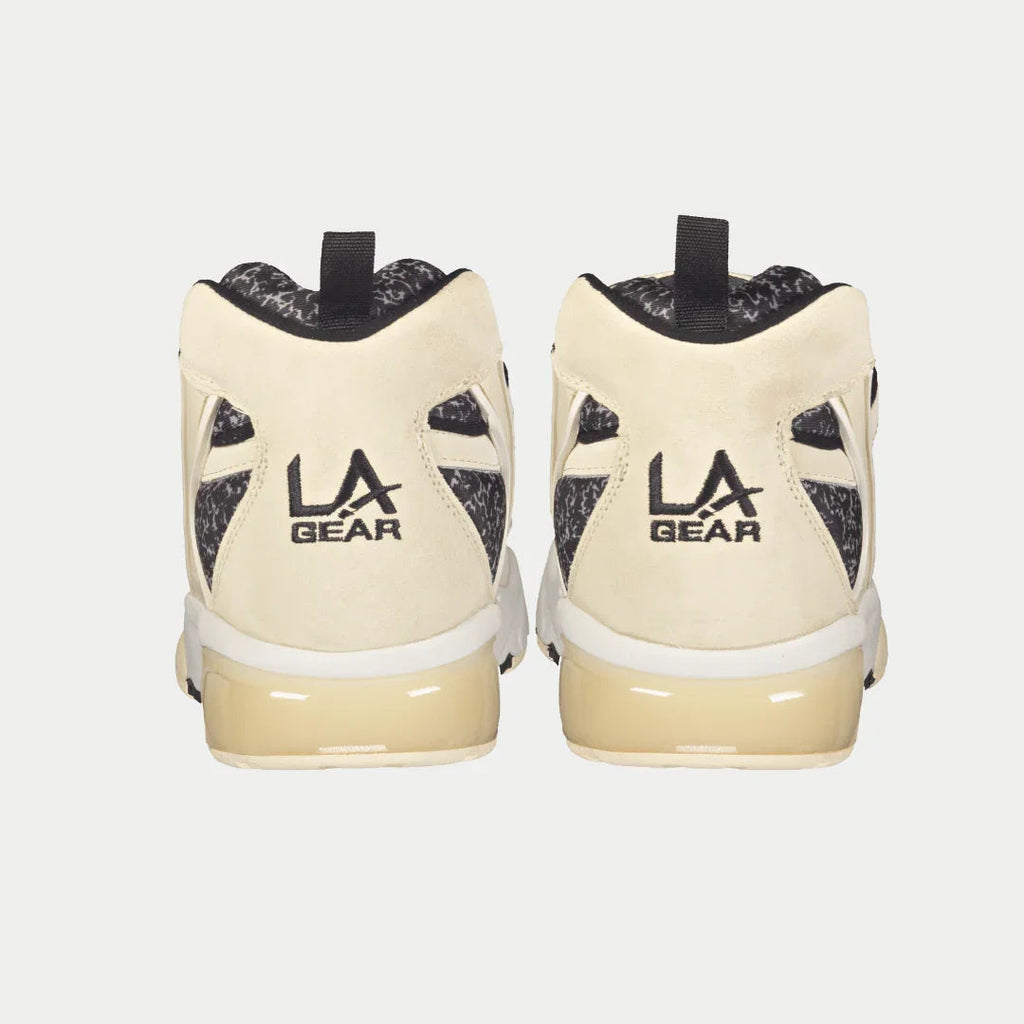 Men's off-white sneaker heels with black padded collar and 'LA GEAR' logo