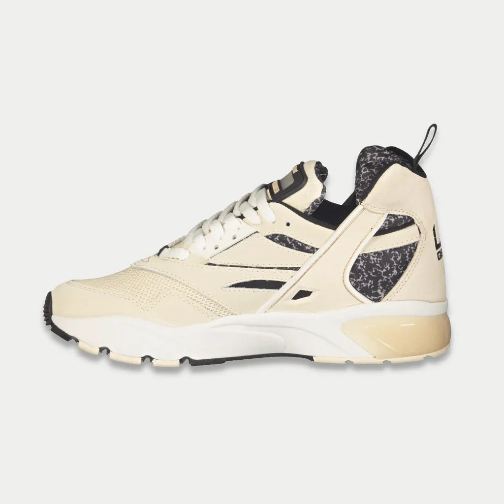 Men's off-white mid-top lace-up sneakers with black heel collar and speckled accents