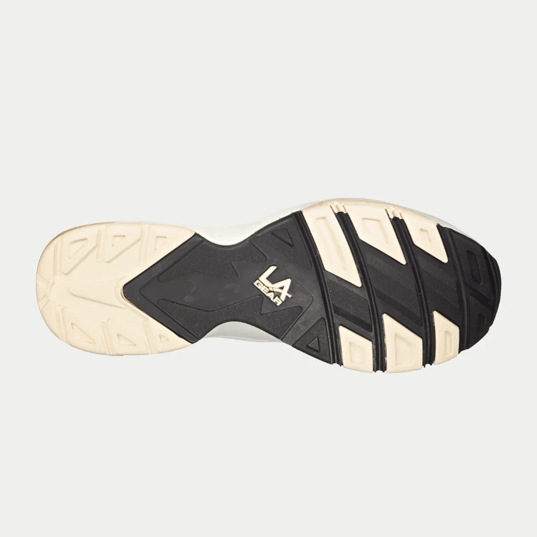 Men's sneaker outsole in off-white and black rubber with tread and LA Gear mark
