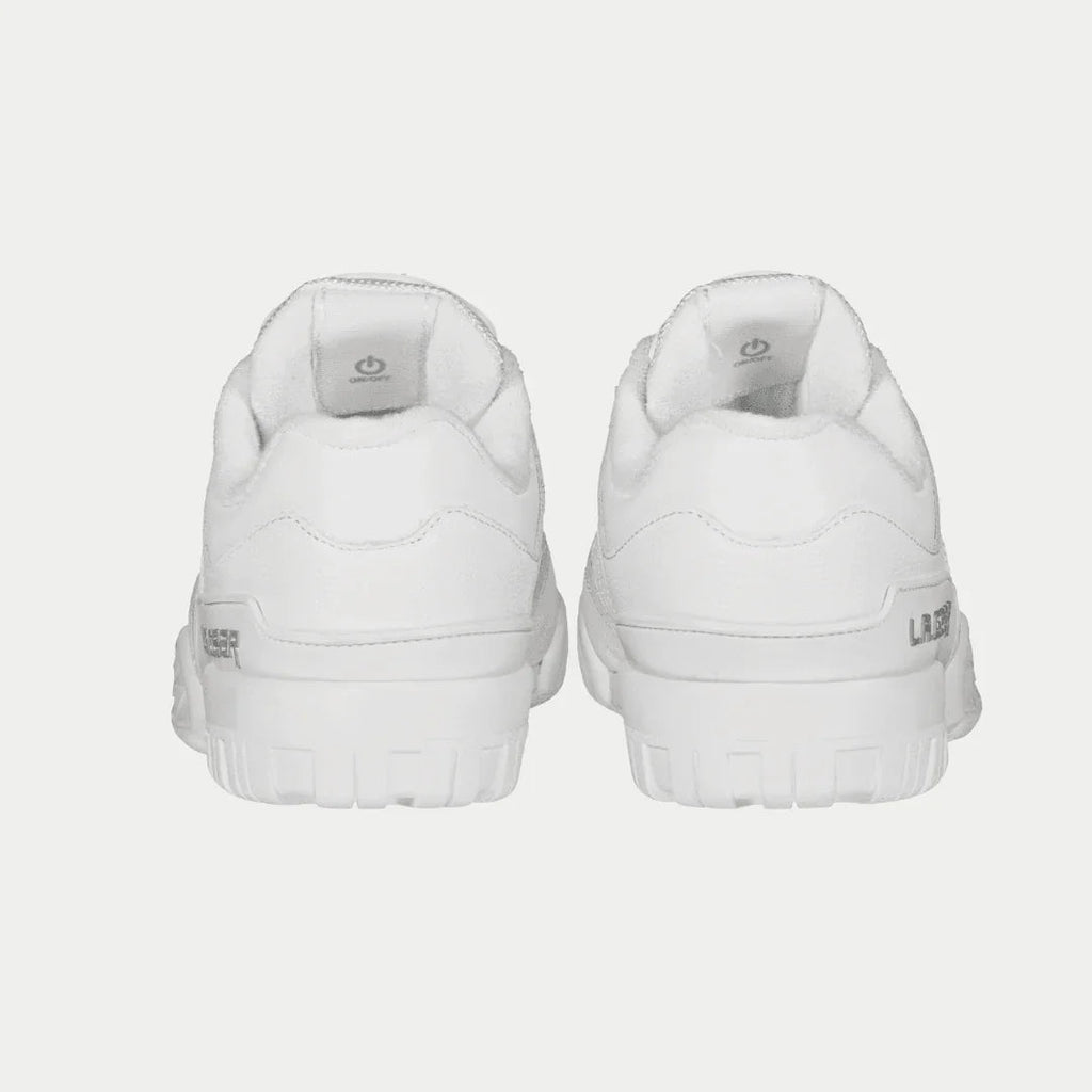 White low-top sneakers, heel view, padded collar and rear LA Gear logo