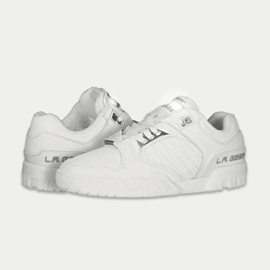 White low-top sneaker, angled side view, lace-up with stitched branding details