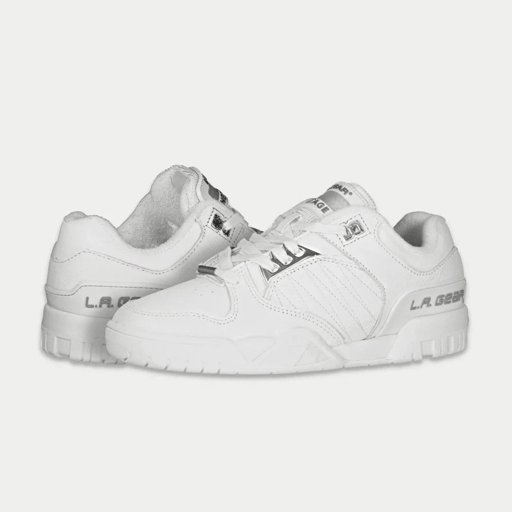 White low-top sneaker, side view, with LA Gear logo and chunky rubber sole