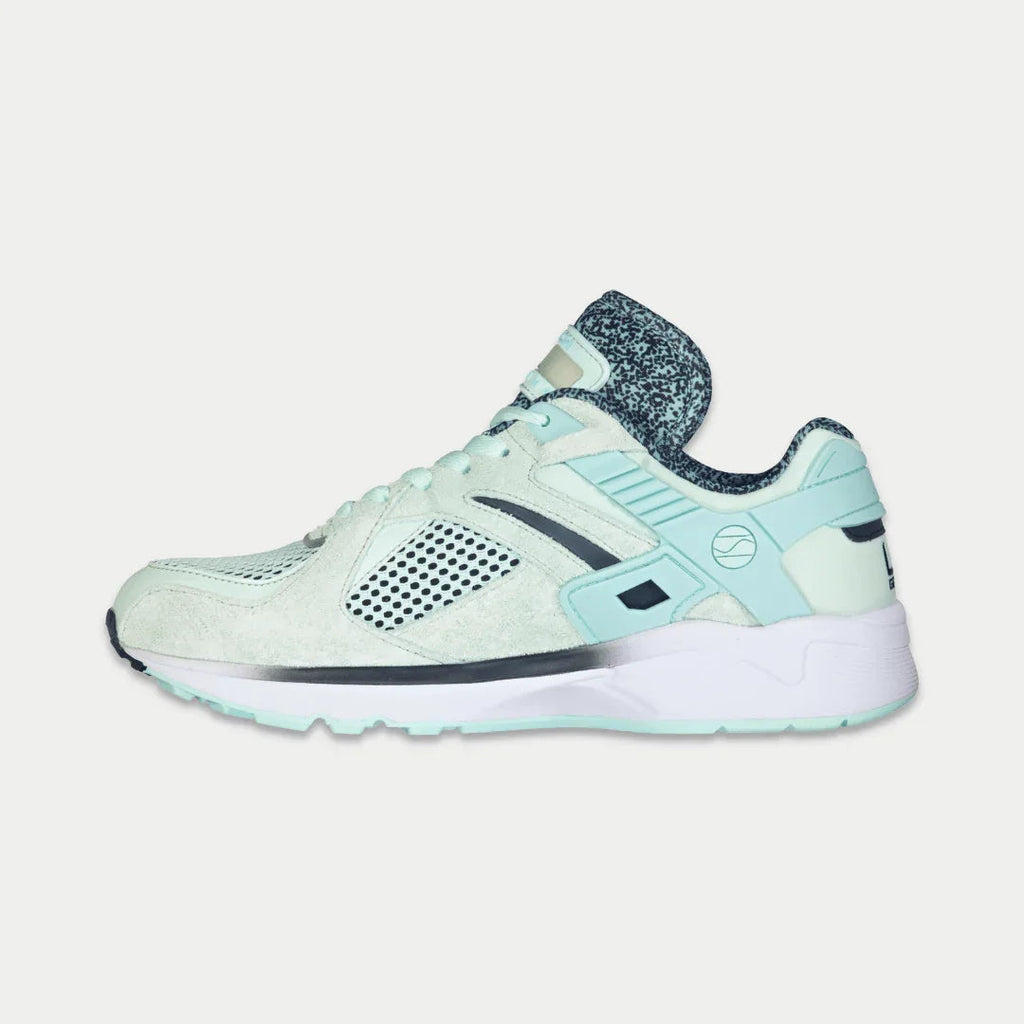Mint lowtop sneaker front quarter view with perforated toe and mesh side