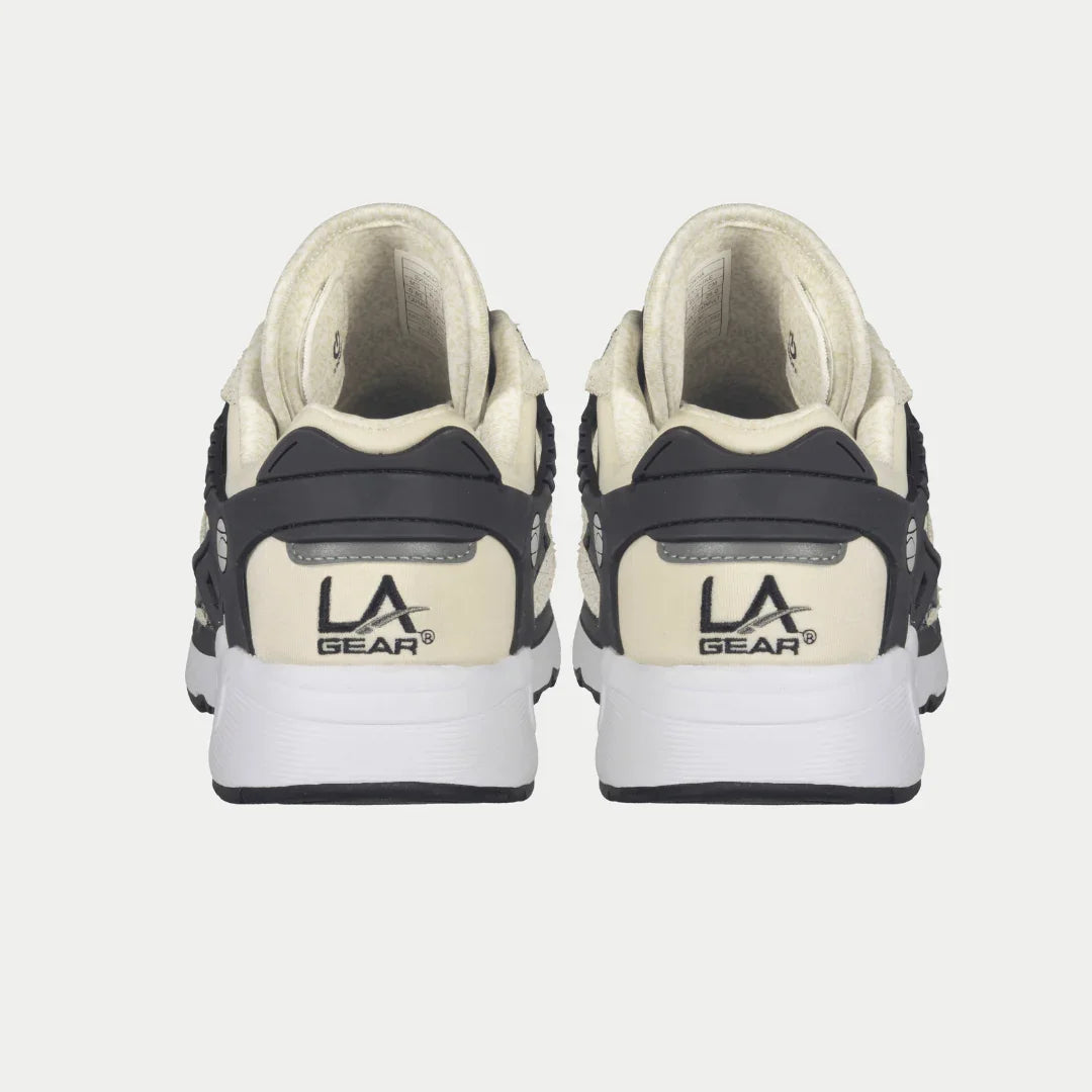 Women’s white and black lowtop sneakers with LA Gear logo on heel.