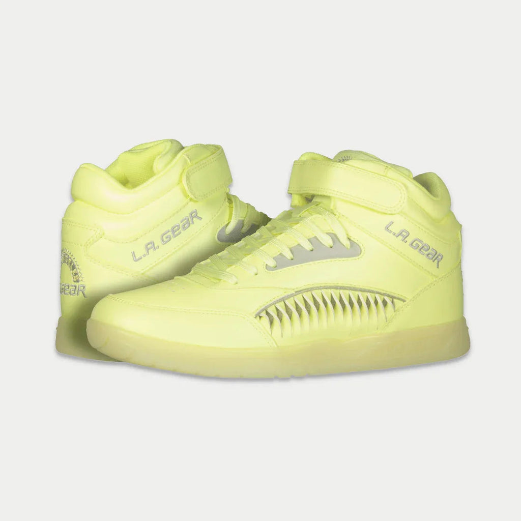 Neon yellow lace-up high-top sneakers with LA Gear branding and ridged swoosh panel