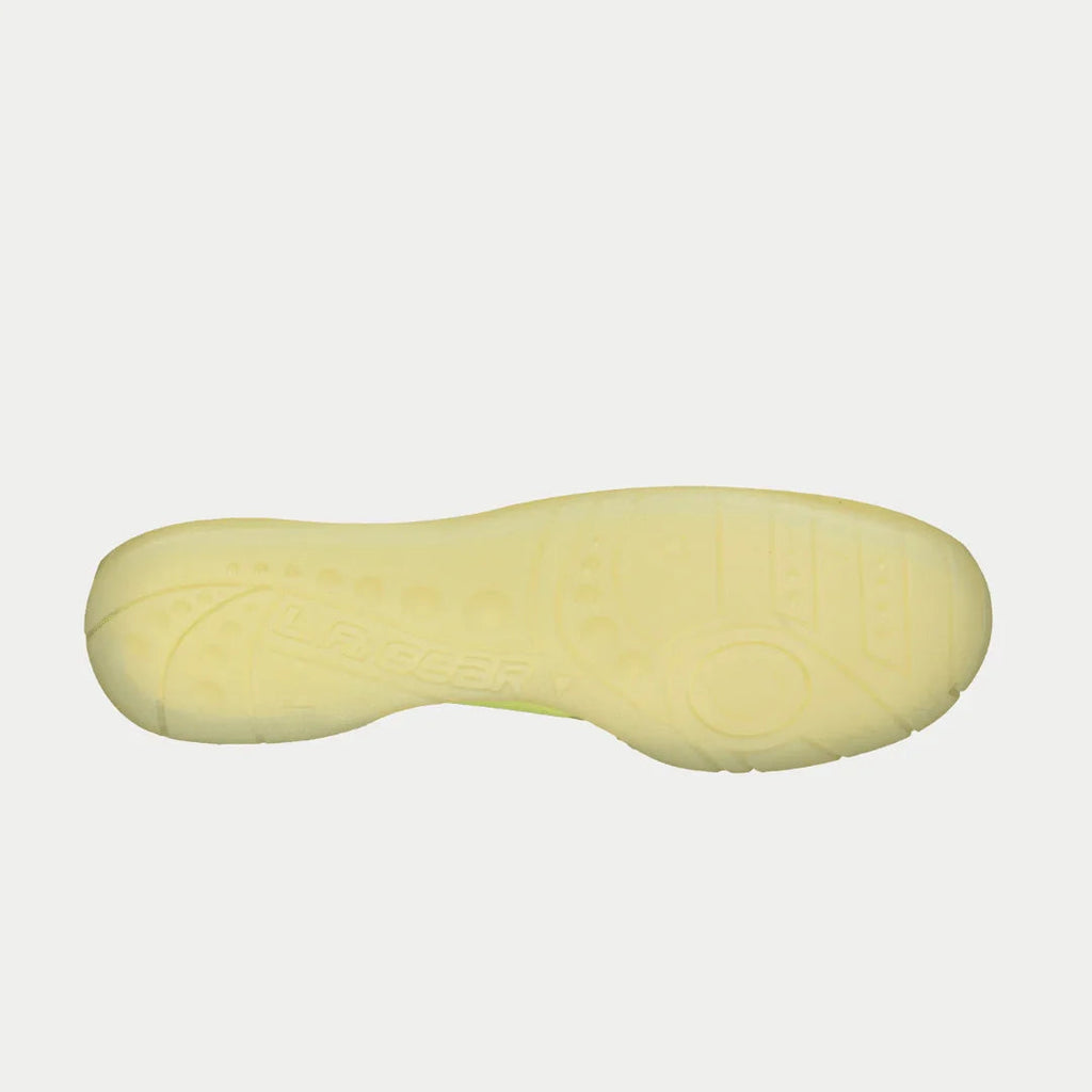 Neon yellow outsole of high-top sneakers with textured tread