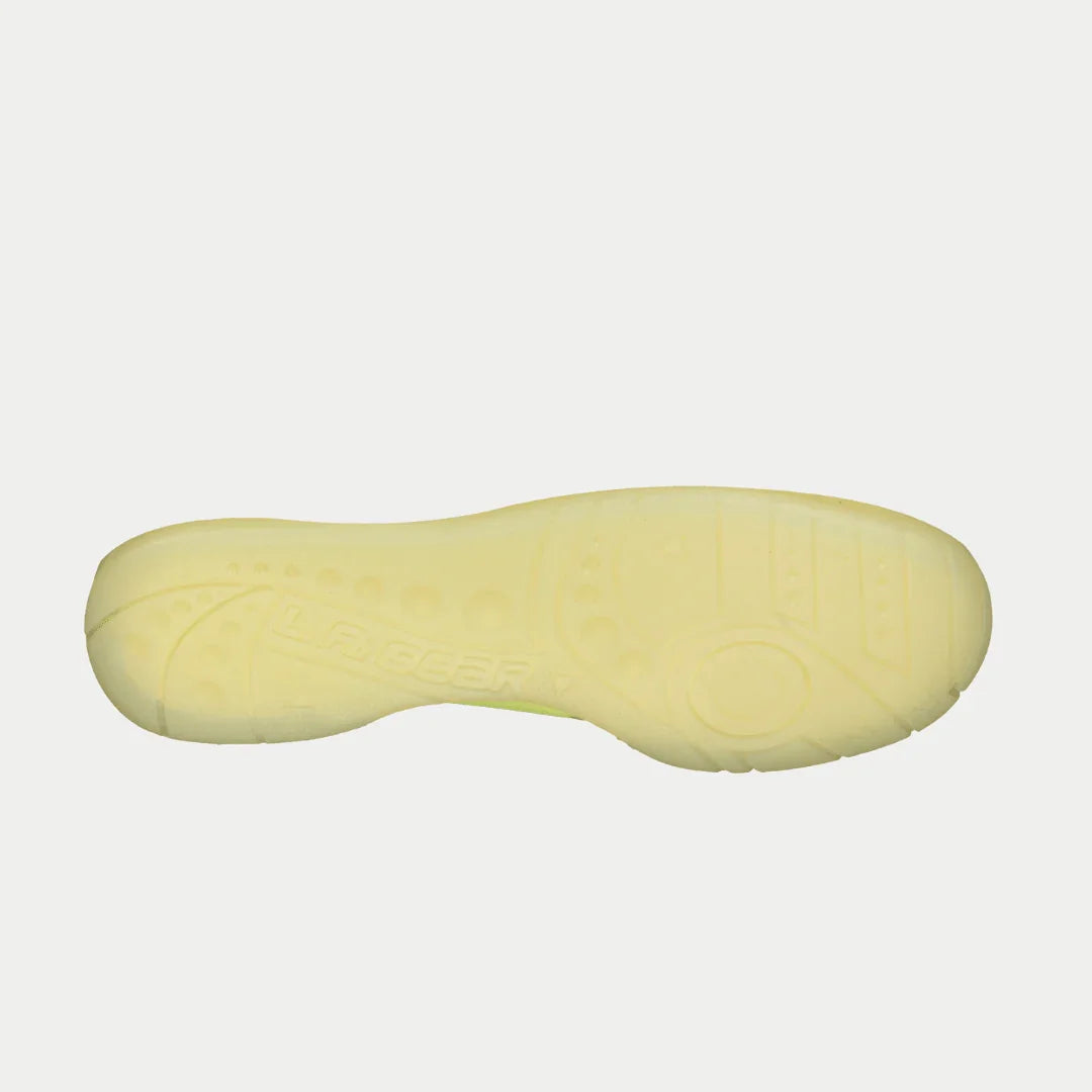Neon yellow outsole of high-top sneakers with textured tread