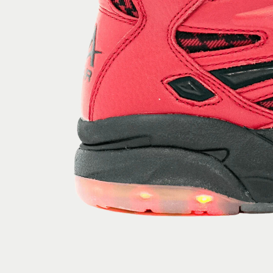 Red high-top sneaker outsole, glowing light-up LEDs near heel