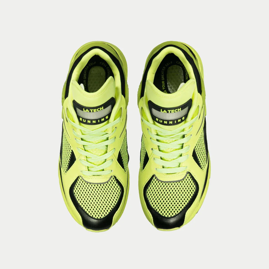 Pair of women's neon yellow and black light-up lowtop sneakers, front view