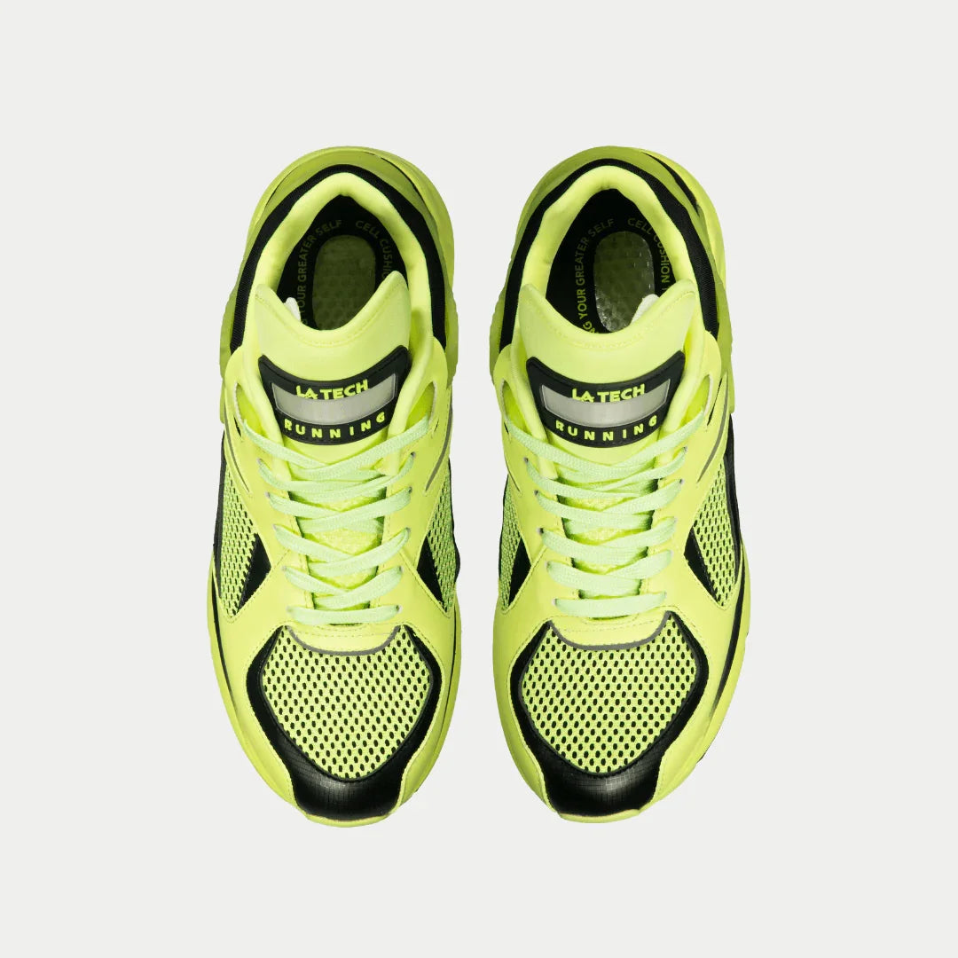 Pair of women's neon yellow and black light-up lowtop sneakers, front view