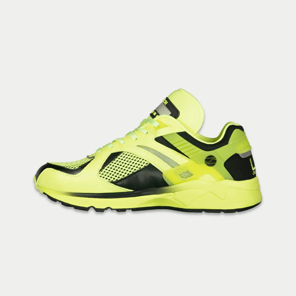 Women's neon yellow and black light-up lowtop sneakers with perforated mesh details