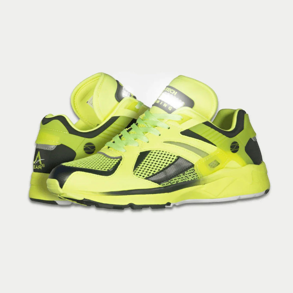 Women's neon yellow and black light-up lowtop sneakers, side profile
